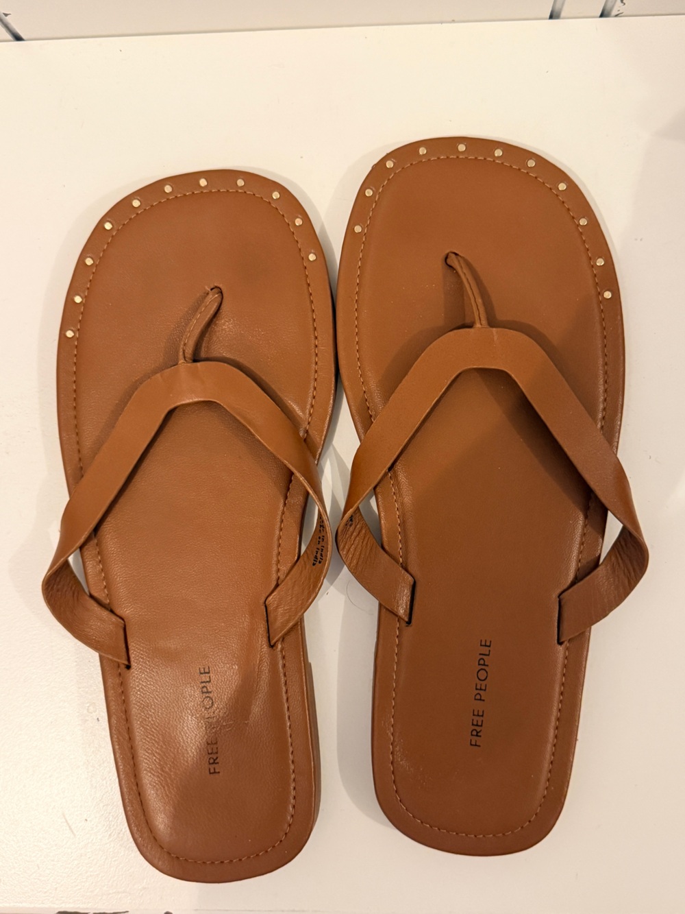 Free People cognac flip flops